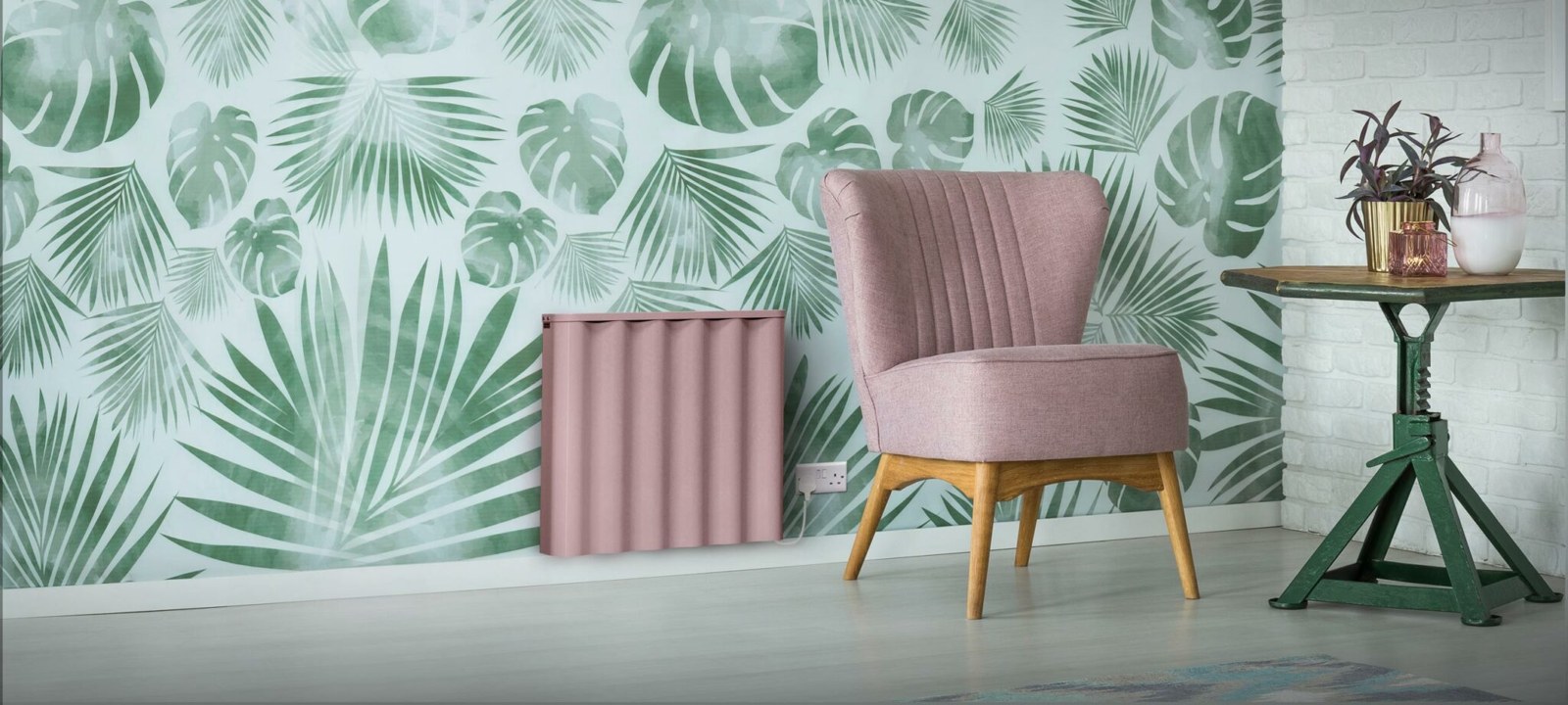 Pink Fischer Tide radiator in a room with patterned wallpaper