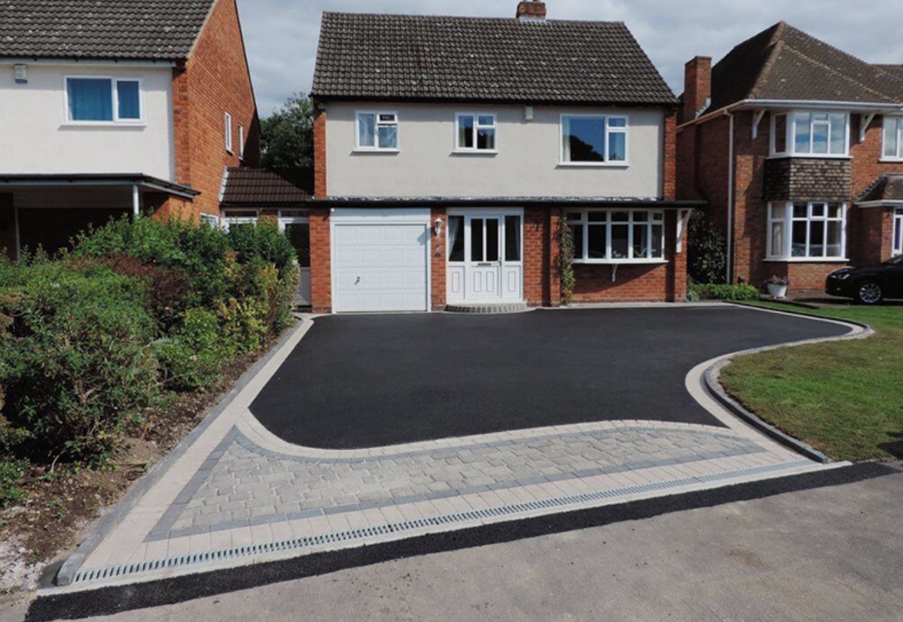 New tarmac driveway with block paved apron and linear drainage